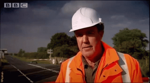 Jeremy Clarkson putting on a hard hat for site safety